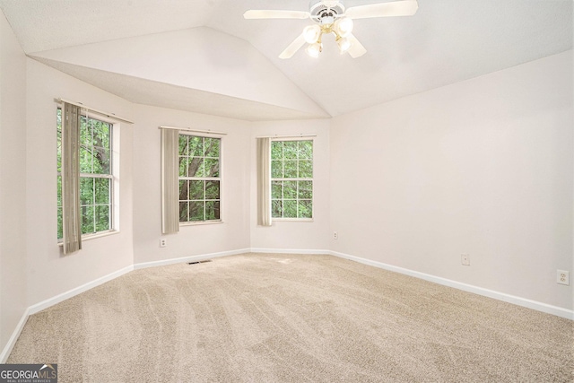4795 Wilkins Station Dr, Decatur, GA 30035 - carpeted empty room featuring baseboards, ceiling fan, vaulted ceiling, and a healthy amount of sunlight