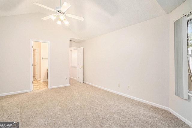 4795 Wilkins Station Dr, Decatur, GA 30035 - unfurnished bedroom with baseboards, a ceiling fan, lofted ceiling, and light carpet