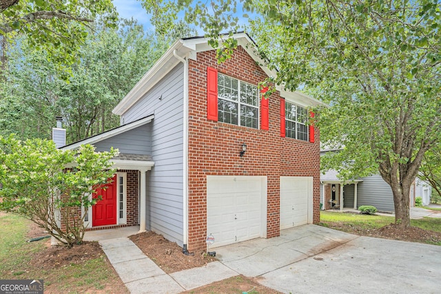 4795 Wilkins Station Dr, Decatur, GA 30035 - view of front facade with brick siding, a garage, and concrete driveway