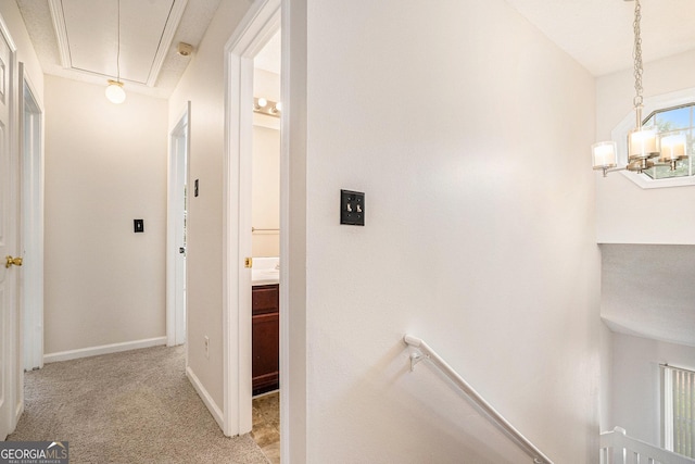 4795 Wilkins Station Dr, Decatur, GA 30035 - hallway with baseboards, attic access, carpet, and an upstairs landing