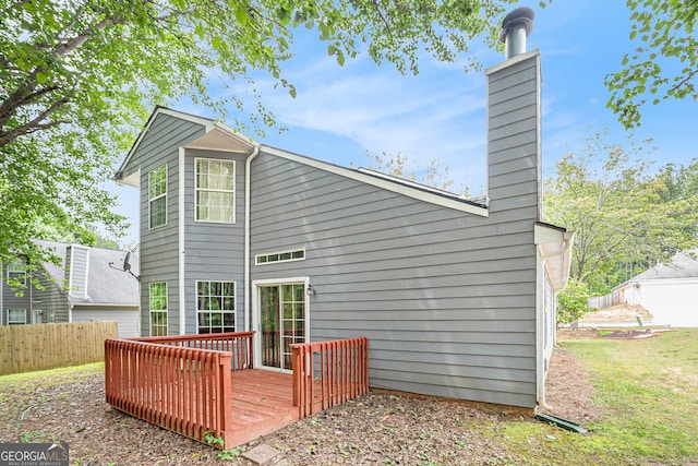 4795 Wilkins Station Dr, Decatur, GA 30035 - rear view of property featuring fence, a wooden deck, and a chimney