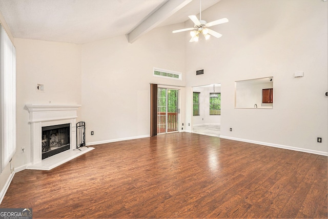4795 Wilkins Station Dr, Decatur, GA 30035 - unfurnished living room featuring ceiling fan, a fireplace with raised hearth, baseboards, wood finished floors, and visible vents