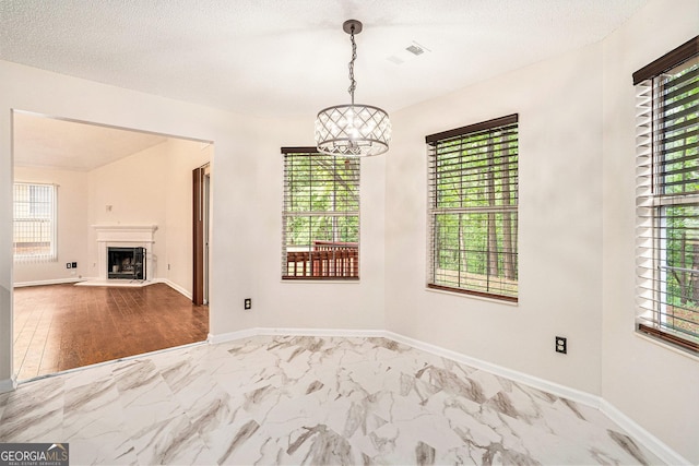 4795 Wilkins Station Dr, Decatur, GA 30035 - unfurnished dining area featuring a wealth of natural light, marble finish floor, and a chandelier