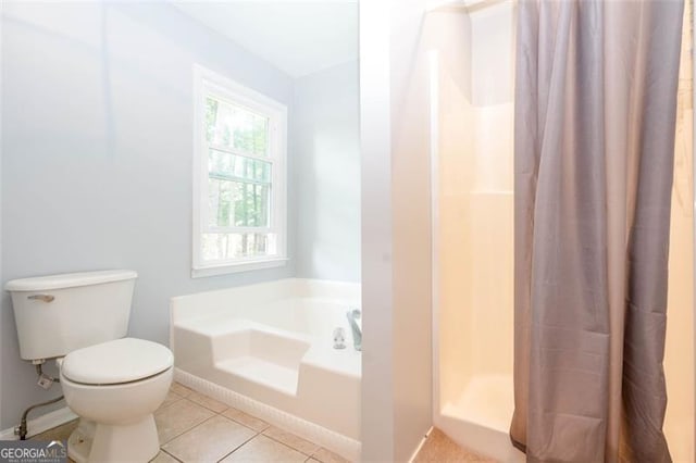 5873 Trellis Ct, Powder Springs, GA 30127 - bathroom featuring tile patterned floors, a garden tub, toilet, and curtained shower