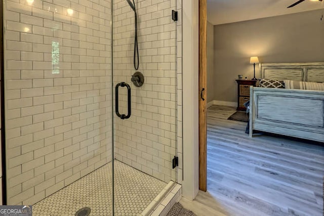 346 Woodland Ln, Hayesville, NC 28904 - bathroom featuring baseboards, ceiling fan, a shower stall, and wood finished floors