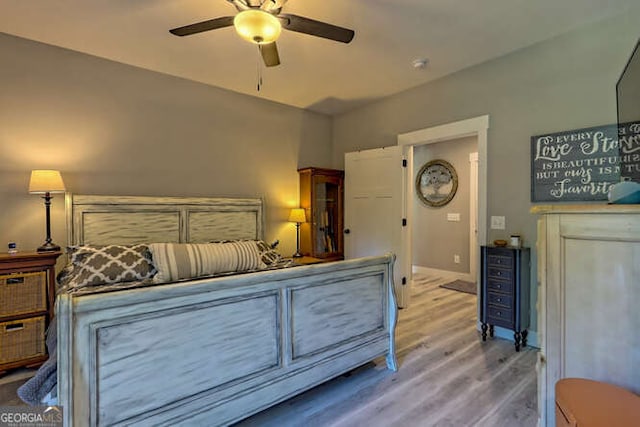 346 Woodland Ln, Hayesville, NC 28904 - bedroom featuring baseboards, a ceiling fan, and wood finished floors