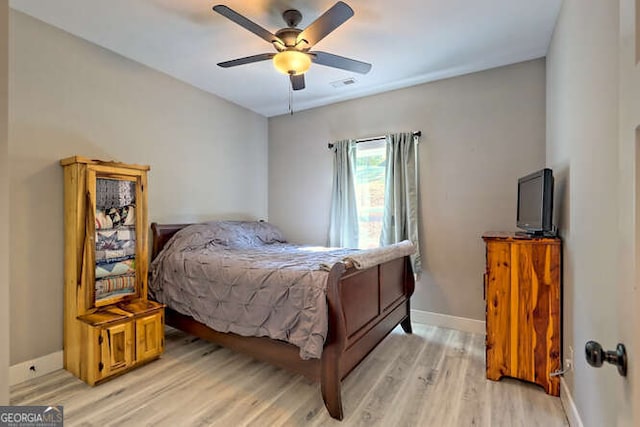 346 Woodland Ln, Hayesville, NC 28904 - bedroom with baseboards, ceiling fan, light wood-style flooring, and visible vents