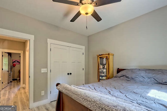 346 Woodland Ln, Hayesville, NC 28904 - bedroom featuring a closet, ceiling fan, baseboards, and light wood-style floors