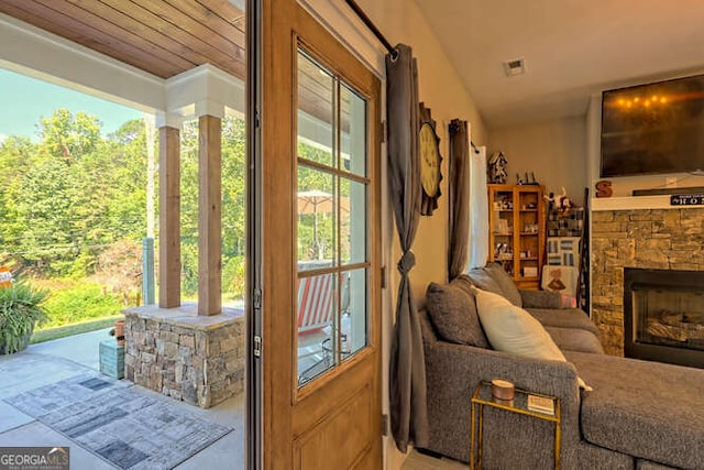 346 Woodland Ln, Hayesville, NC 28904 - doorway with visible vents, lofted ceiling, and a fireplace