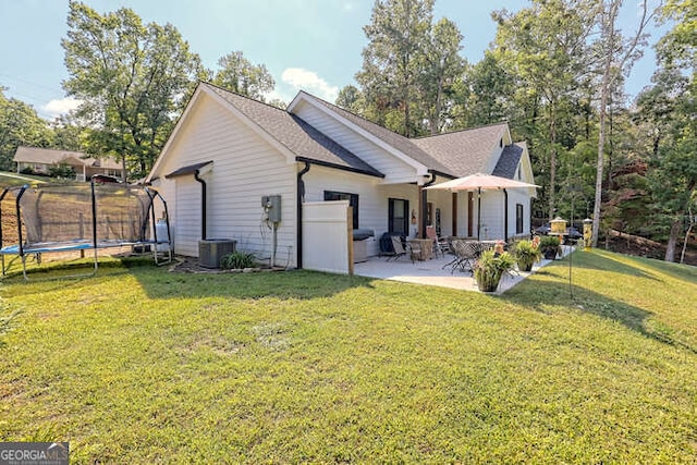 346 Woodland Ln, Hayesville, NC 28904 - back of house with a lawn, a patio, cooling unit, and a trampoline