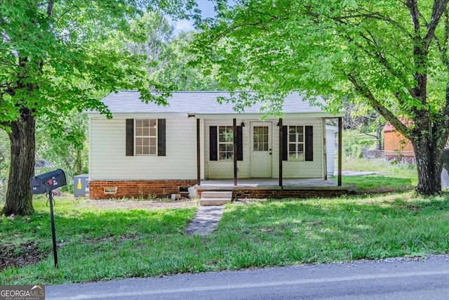613 Bradley Ave, Lafayette, GA 30728 - ranch-style house with a porch and a front yard