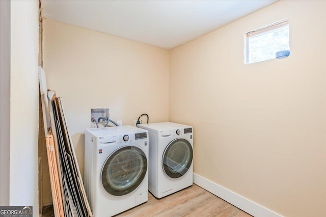 613 Bradley Ave, Lafayette, GA 30728 - laundry room with washing machine and clothes dryer, laundry area, baseboards, and light wood-type flooring