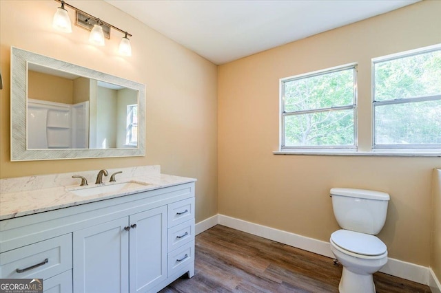 613 Bradley Ave, Lafayette, GA 30728 - bathroom with baseboards, plenty of natural light, toilet, and wood finished floors