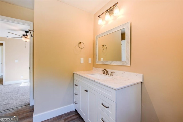 613 Bradley Ave, Lafayette, GA 30728 - bathroom featuring a ceiling fan, baseboards, wood finished floors, and vanity