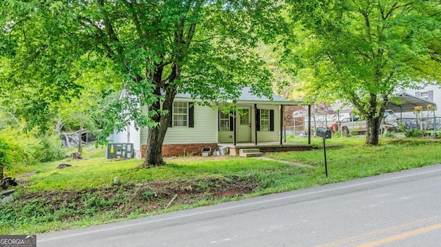613 Bradley Ave, Lafayette, GA 30728 - view of front of house with a porch, a front lawn, and fence