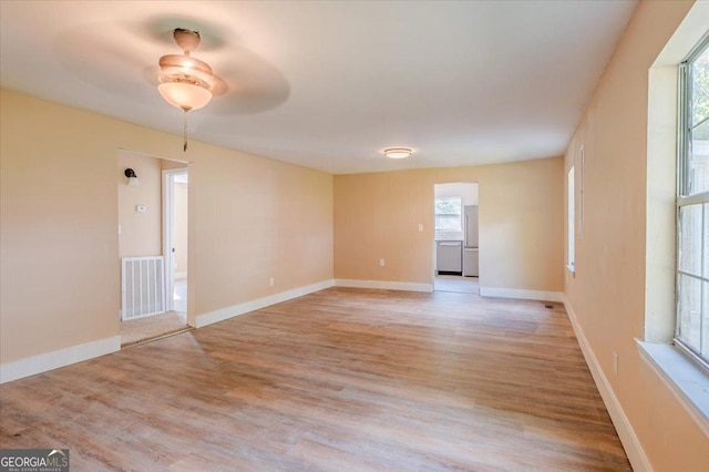 613 Bradley Ave, Lafayette, GA 30728 - spare room with visible vents, a ceiling fan, light wood-style flooring, and baseboards