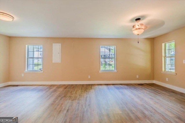 613 Bradley Ave, Lafayette, GA 30728 - unfurnished room with baseboards, a ceiling fan, wood finished floors, and electric panel