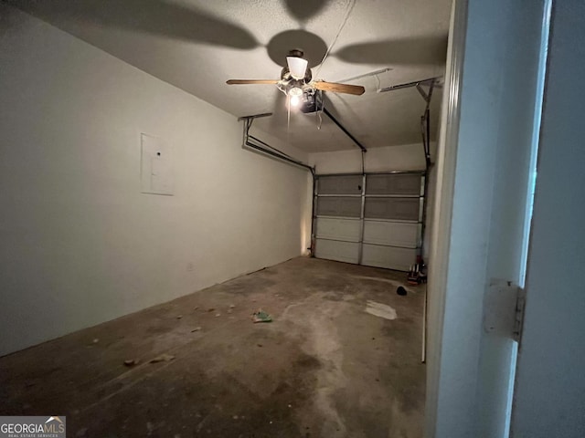 garage featuring a garage door opener and a ceiling fan