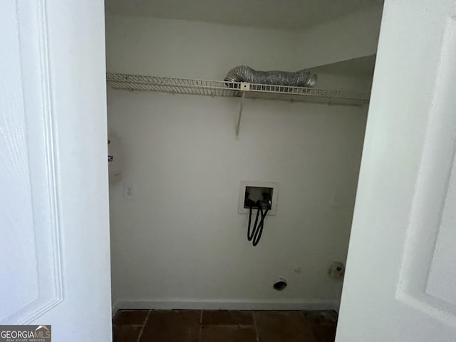 laundry area with tile patterned flooring, hookup for an electric dryer, laundry area, and hookup for a washing machine