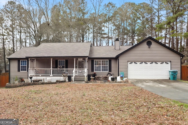 142 Old Hampton Way, Hampton, GA 30228 - ranch-style house featuring fence, a garage, a chimney, concrete driveway, and covered porch