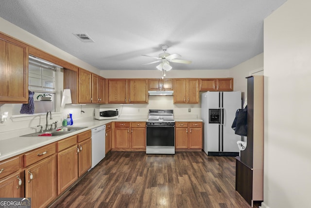 142 Old Hampton Way, Hampton, GA 30228 - kitchen with a ceiling fan, dark wood-style flooring, visible vents, a sink, and white appliances