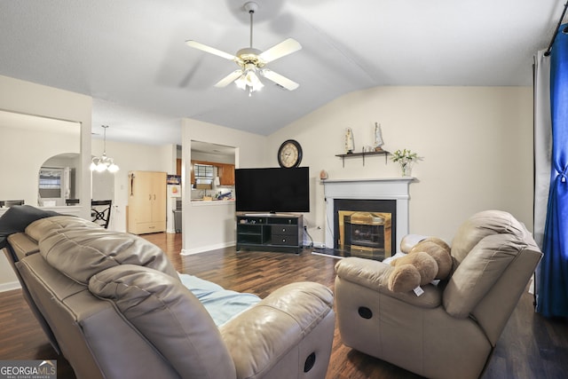 142 Old Hampton Way, Hampton, GA 30228 - living room with ceiling fan with notable chandelier, lofted ceiling, and dark wood-style floors