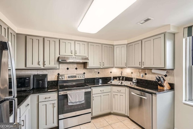 199 14th St Unit 2502, Atlanta, GA 30309 - kitchen with visible vents, gray cabinets, under cabinet range hood, a sink, and appliances with stainless steel finishes