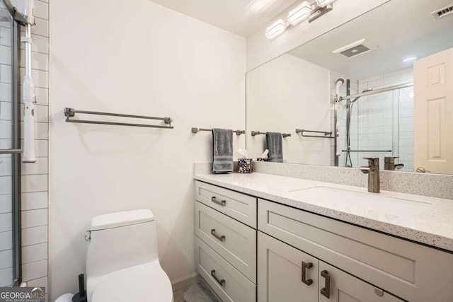 199 14th St Unit 2502, Atlanta, GA 30309 - bathroom featuring vanity, toilet, visible vents, and a stall shower