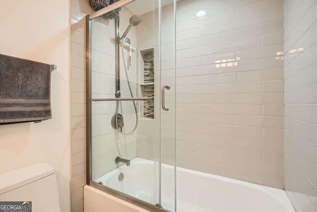 199 14th St Unit 2502, Atlanta, GA 30309 - full bath featuring bath / shower combo with glass door and toilet