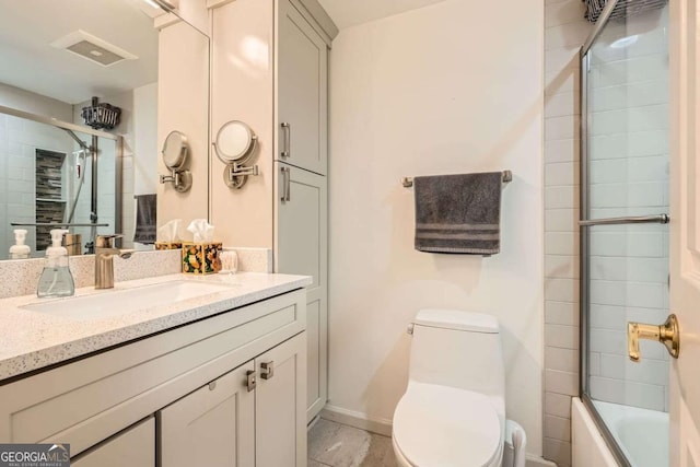 199 14th St Unit 2502, Atlanta, GA 30309 - bathroom with visible vents, vanity, baseboards, toilet, and enclosed tub / shower combo
