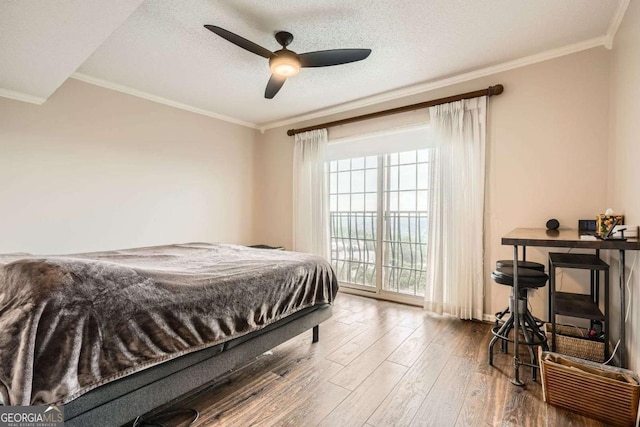 199 14th St Unit 2502, Atlanta, GA 30309 - bedroom with crown molding, access to outside, hardwood / wood-style flooring, and ceiling fan
