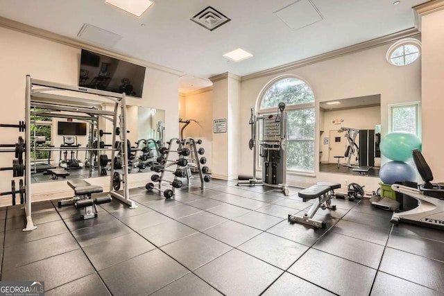 199 14th St Unit 2502, Atlanta, GA 30309 - workout area featuring crown molding, plenty of natural light, and visible vents