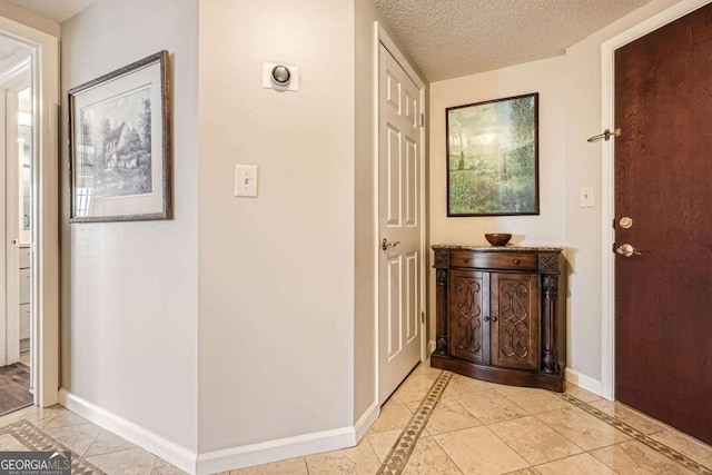 199 14th St Unit 2502, Atlanta, GA 30309 - corridor featuring baseboards and a textured ceiling