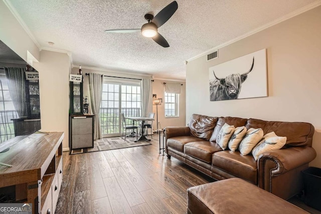 199 14th St Unit 2502, Atlanta, GA 30309 - living room featuring visible vents, a ceiling fan, and ornamental molding