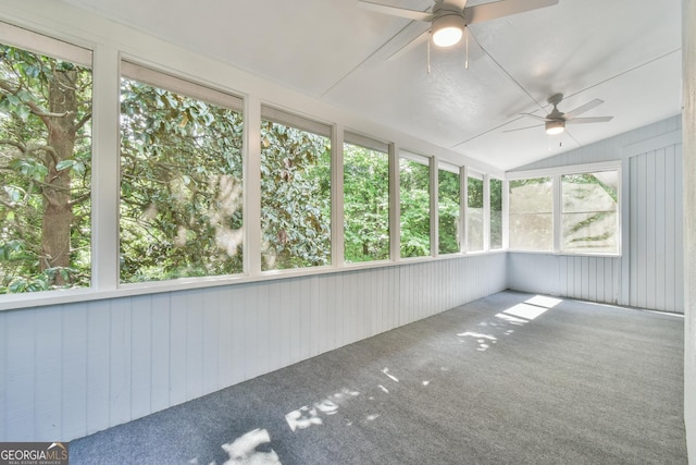 unfurnished sunroom featuring ceiling fan