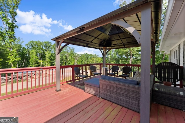 wooden deck featuring a gazebo and an outdoor hangout area