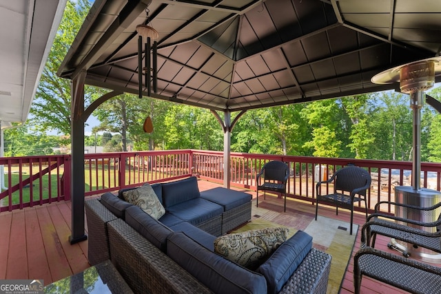wooden terrace featuring outdoor lounge area