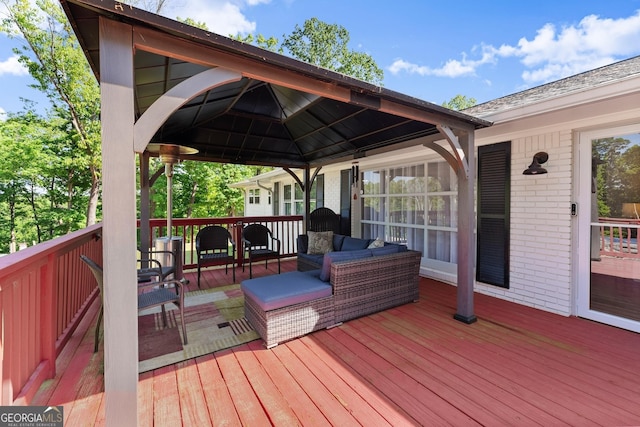 deck with a gazebo and an outdoor hangout area
