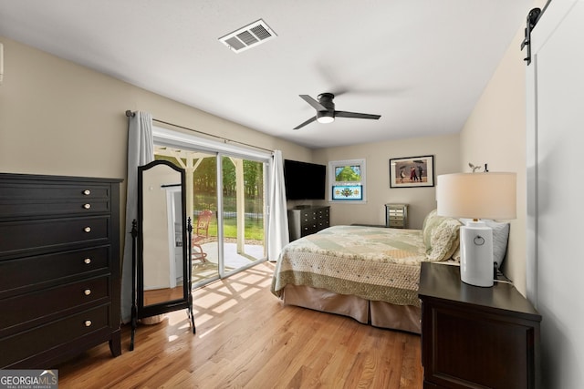 bedroom featuring visible vents, light wood-style floors, ceiling fan, and access to exterior