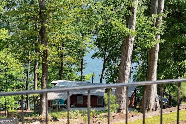 exterior space with a water view
