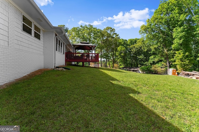 view of yard featuring a wooden deck