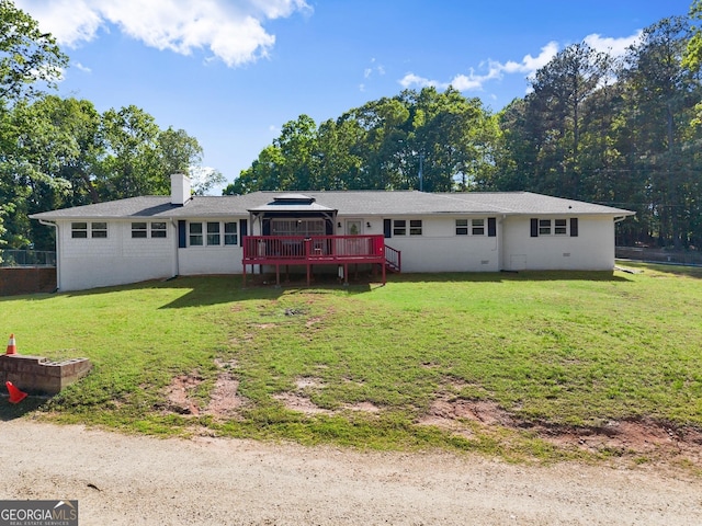 view of front of house featuring a gazebo, a wooden deck, a front yard, and a chimney