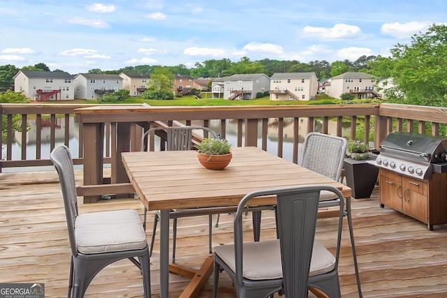 1544 Overview Cir, Lawrenceville, GA 30044 - deck featuring a grill, a residential view, outdoor dining space, and a water view
