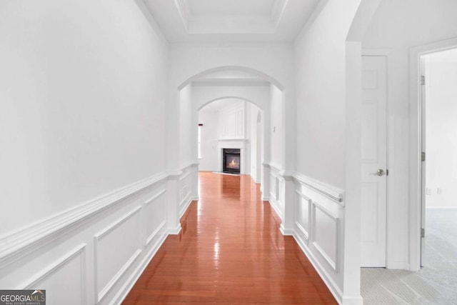 1544 Overview Cir, Lawrenceville, GA 30044 - hallway featuring a decorative wall, wainscoting, and arched walkways