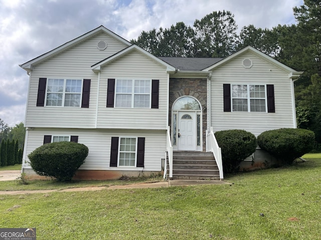 127 Mabry Rd, Jackson, GA 30233 - split foyer home featuring a front yard, stone siding, and entry steps
