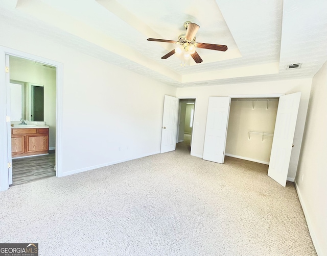 127 Mabry Rd, Jackson, GA 30233 - unfurnished bedroom featuring a raised ceiling, baseboards, a closet, and carpet flooring