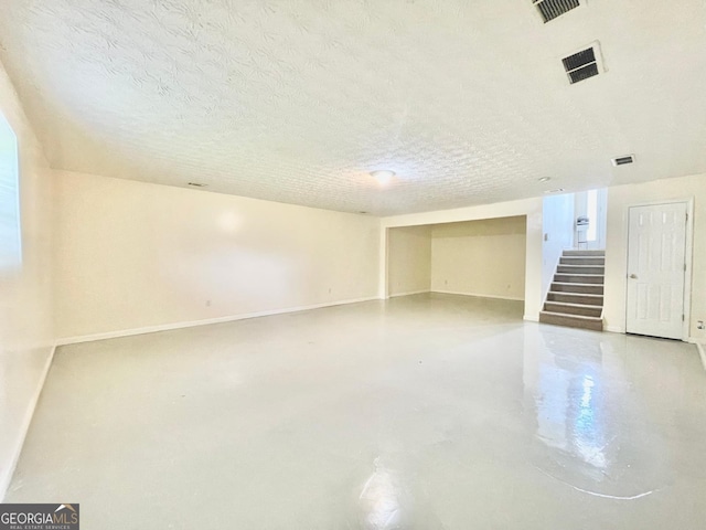 127 Mabry Rd, Jackson, GA 30233 - finished basement featuring stairs, a textured ceiling, and baseboards