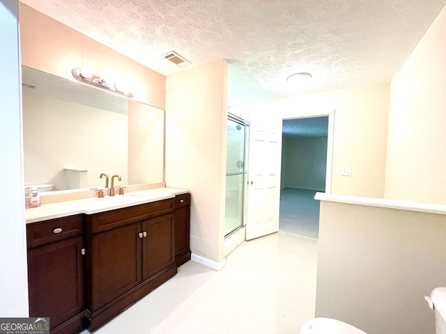 127 Mabry Rd, Jackson, GA 30233 - bathroom featuring a shower stall, vanity, a textured ceiling, and toilet