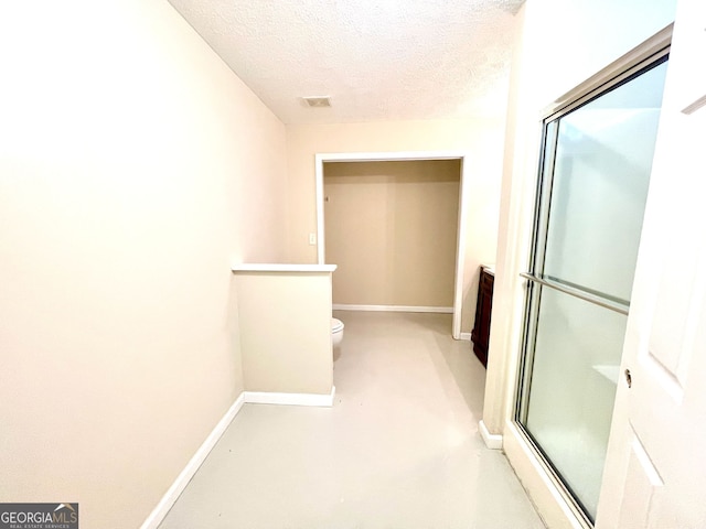 127 Mabry Rd, Jackson, GA 30233 - corridor featuring a textured ceiling and baseboards