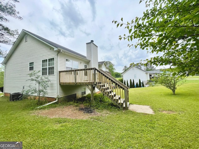 127 Mabry Rd, Jackson, GA 30233 - back of house with stairs, a wooden deck, a yard, and a chimney